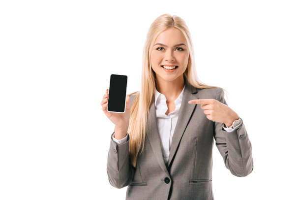 smiling businesswoman pointing at blank screen on smartphone, isolated on white - Φωτογραφία, εικόνα