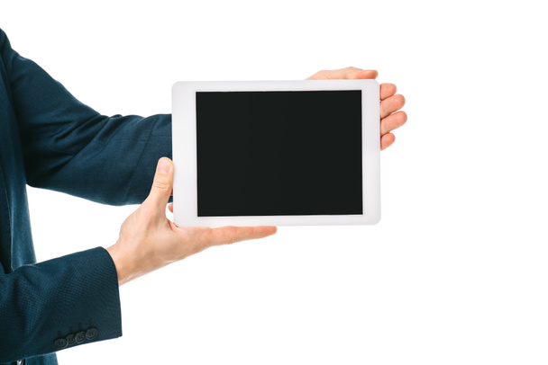 partial view of businessman showing digital tablet with blank screen isolated on white - Fotó, kép