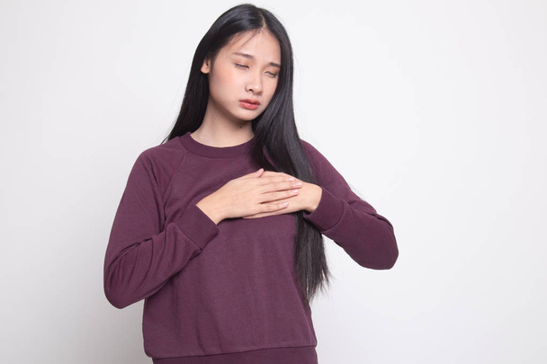 Young Asian woman got chest pain on white background - Fotoğraf, Görsel