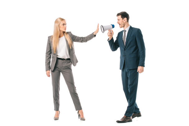 male boss shouting into megaphone at businesswoman who showing stop gesture isolated on white, gender equality concept - Photo, Image