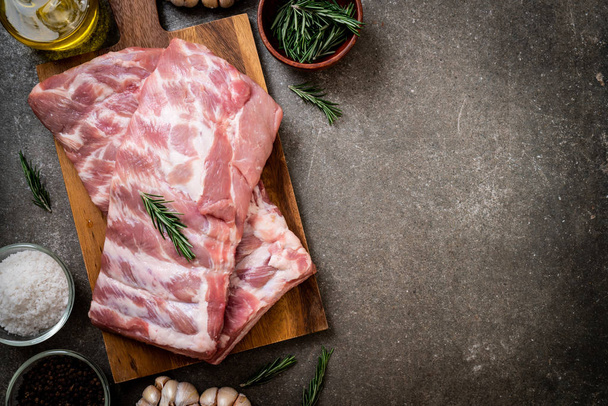 Fresh raw pork ribs with ingredients - Фото, изображение