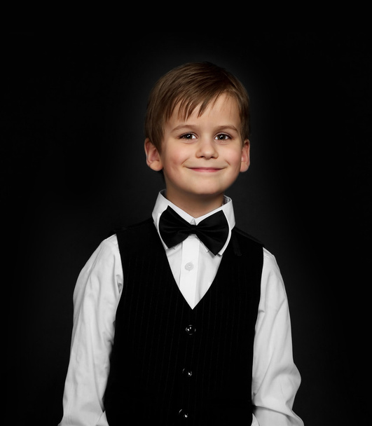 Boy in a suit smiles - Fotó, kép