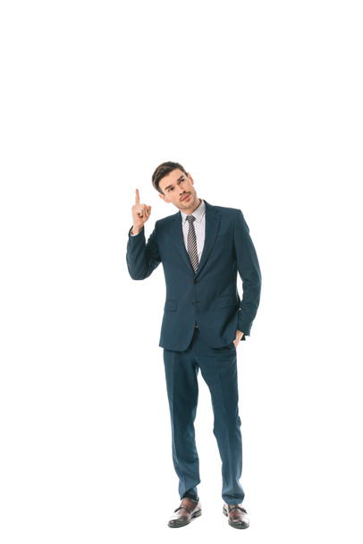 pensive businessman pointing up isolated on white - Photo, Image