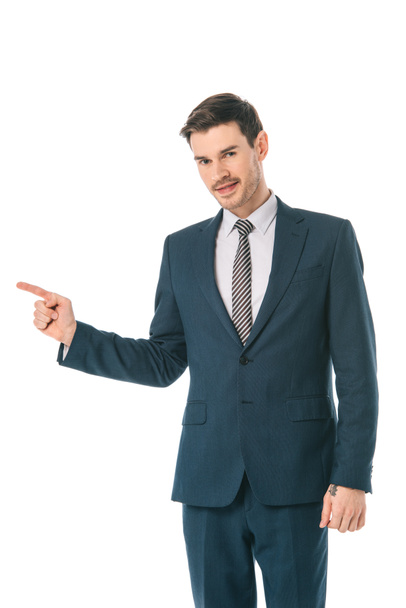 successful businessman pointing at something isolated on white - Fotografie, Obrázek