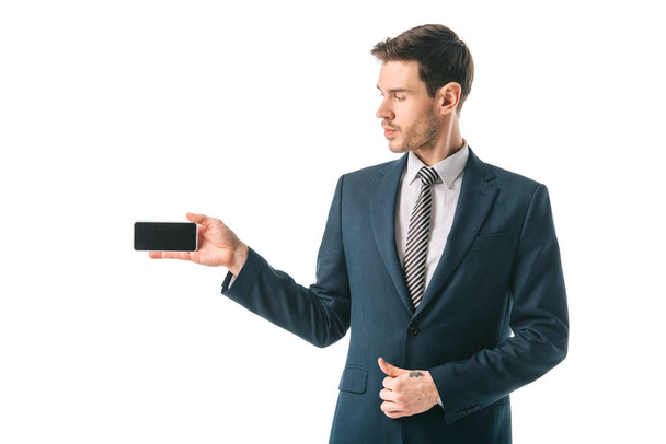 businessman presenting smartphone with blank screen, isolated on white - Fotoğraf, Görsel
