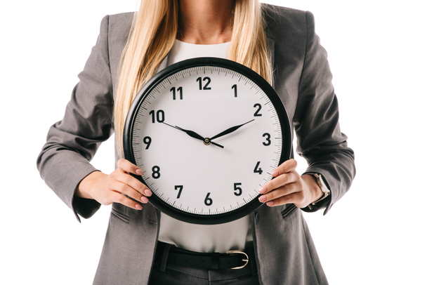 cropped view of businesswoman holding clock isolated on white - Foto, immagini