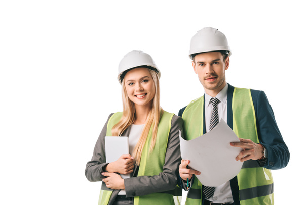 engineers in safety vests and hardhats holding digital tablet and blueprint, isolated on white - Φωτογραφία, εικόνα