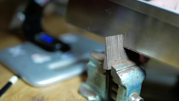 carpenter saws the teeth of the comb billet of wenge - Footage, Video