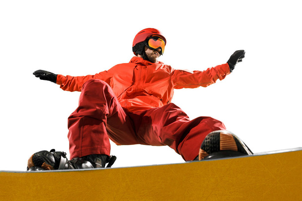 Portrait of young man in sportswear with snowboard isolated on a white background. - Photo, image
