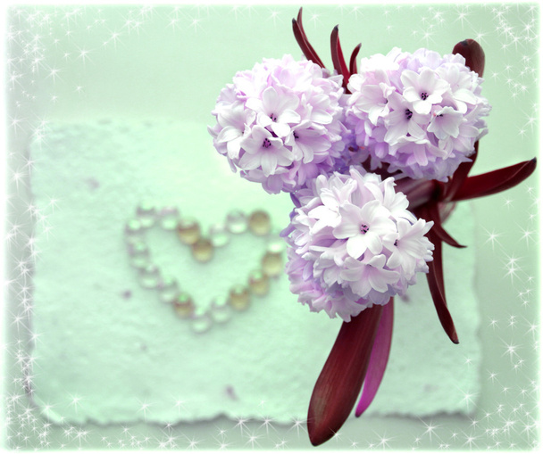 Hyacinth flower with a heart from glass beads - Foto, Imagen