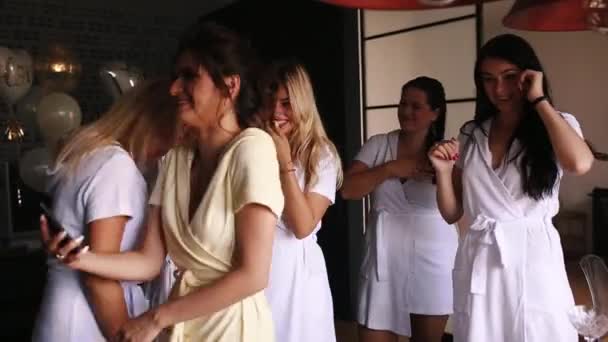Girls shaking by glasses with champagne on hen party. - Footage, Video