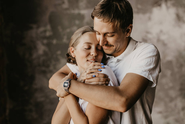 Beautiful loving couple are laughing and hugging - Fotografie, Obrázek