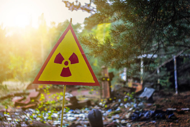 sign of a radioactive danger on an old dump of contaminated waste after a catastrophe - Photo, Image