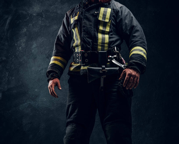 Cropped image of a fireman wearing full protective equipment - Valokuva, kuva