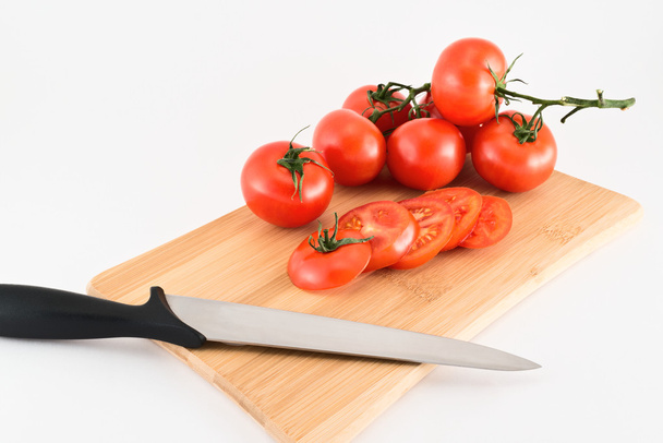 Cutting red tomatoes composition background - Foto, afbeelding