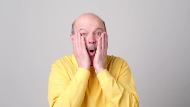 surprised senior bald man can not believe his eyes. - Footage, Video