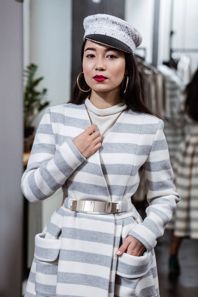 Young asian beaming woman with red lipstick feeling confident - Valokuva, kuva