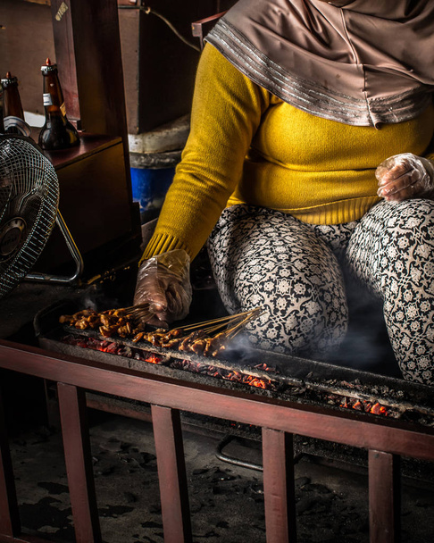 Chicken satay grill at a busy street food market  - Photo, Image
