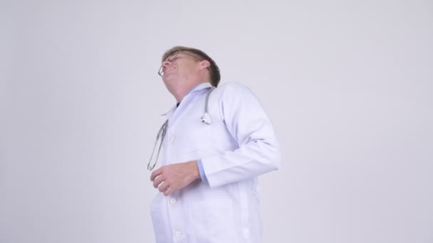 Stressed young man doctor having back pain - Filmagem, Vídeo