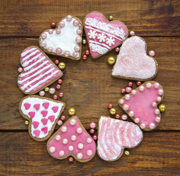Wreath of cookies Heart with topping and icing top View on Wodden background Copy Space Square - Fotó, kép