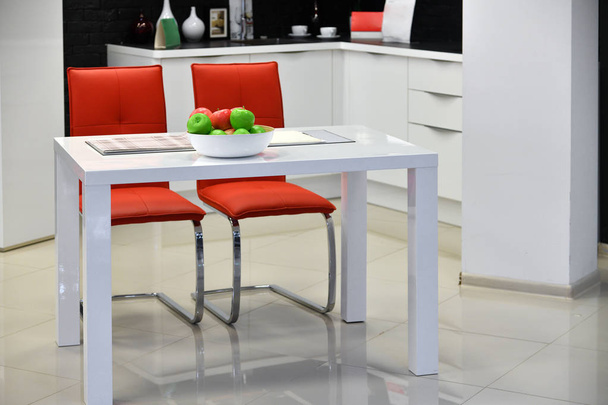 Fragment of white kitchen interior with table - Foto, Imagen