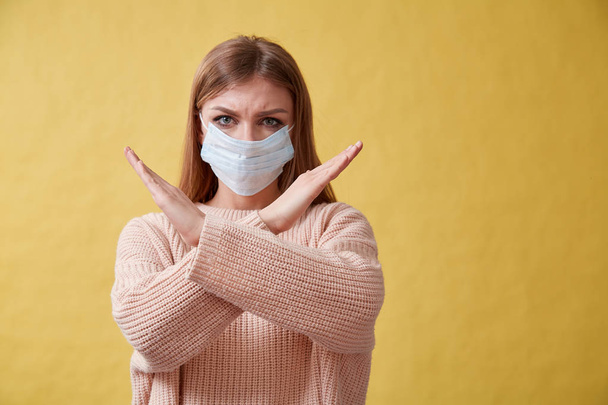 Young ill woman coughing on isolated background, sore throat - Photo, image