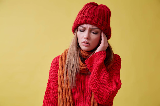 Young ill woman in the red sweater coughing standing on the yellow background, sore throat - Fotoğraf, Görsel