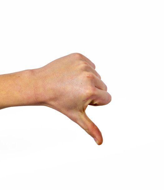 primer plano de Pulgar hacia abajo signo de mano masculina aislado sobre un fondo blanco
 - Foto, imagen