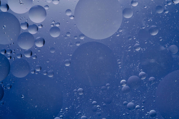 Water oil bubble macro abstract background flow liquid blue white aqua colors - Photo, Image
