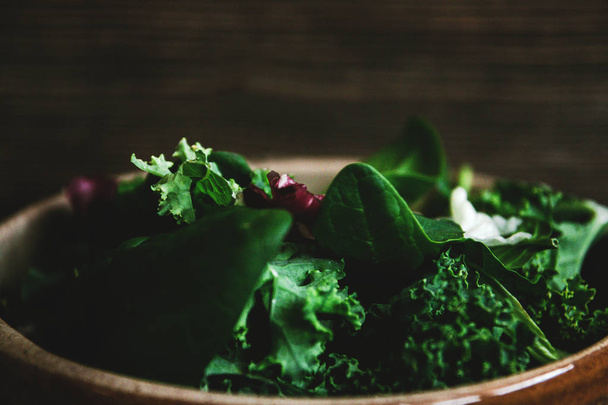 Green vegan Breakfast in a bowl with various leaves, top view. Clean eating, dieting, vegan schematic diagram of the food. - Φωτογραφία, εικόνα