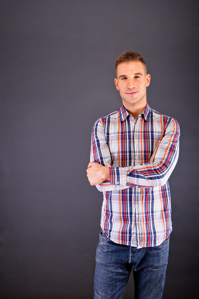 Man overdark background in squared shirt - Fotografie, Obrázek