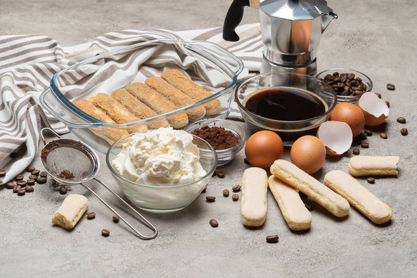 Ingredients for making traditional italian cake tiramisu on concrete table - Photo, image