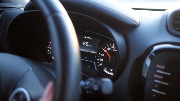 closeup of hand on the steering wheel and speedometer - Footage, Video
