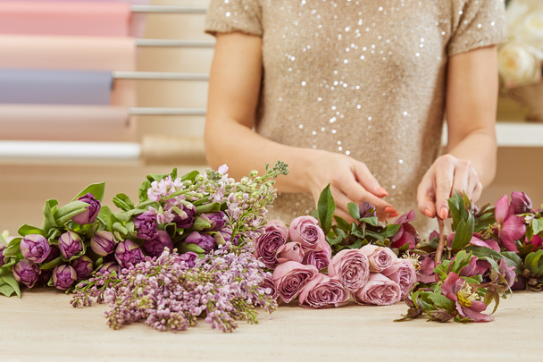cropped view of florist making bouquet of tulips, peonies and lilac - Fotoğraf, Görsel