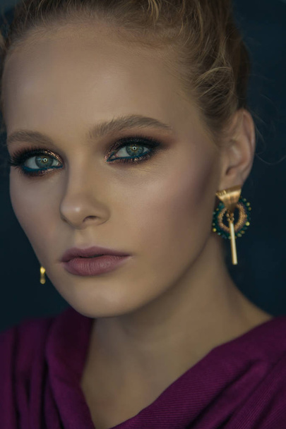 Fashionable portrait of a girl model with professional make-up face close-up - Φωτογραφία, εικόνα