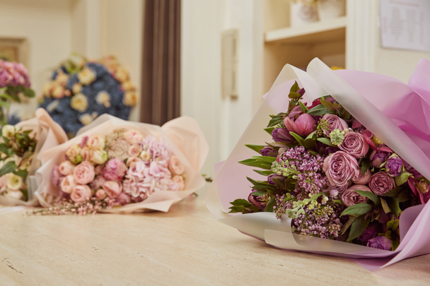 Selective focus of bouquet of tulips, peonies and lilac - Фото, изображение