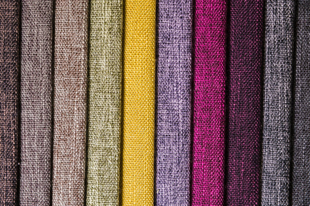 Colorful and bright fabric samples of furniture and clothing upholstery. Close-up of a palette of textile abstract stripes of different colors - Fotó, kép