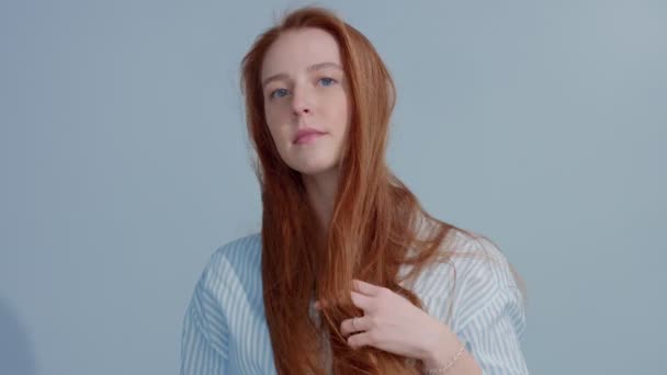 gingerhead red hair, ginger hair model with blue eyes on blue background - Felvétel, videó