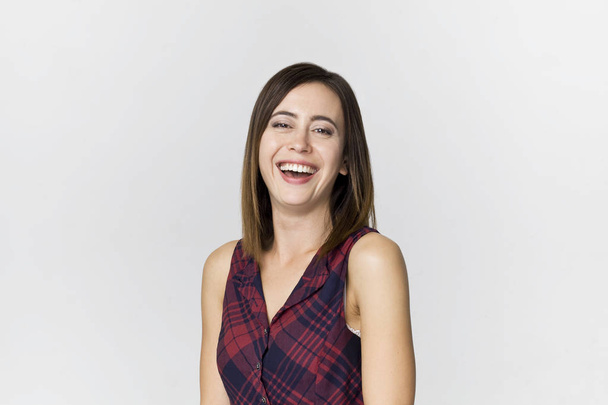Amazing and cheerful smiling brunette woman in beautiful dress studio shot, isolated on white - Φωτογραφία, εικόνα