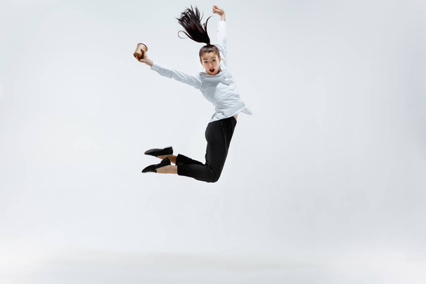 Happy business woman dancing and smiling isolated on white. - Valokuva, kuva