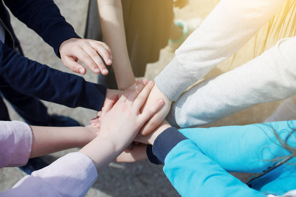group of teenagers hands connecting, concept of teamwork and unity - Valokuva, kuva