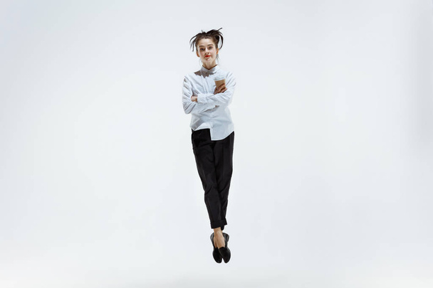 Happy business woman dancing and smiling isolated on white. - Fotó, kép