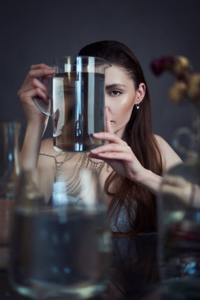 Beauty portrait of girl with water and reflections. Hight quality retouching photo. Fashion model - Fotó, kép
