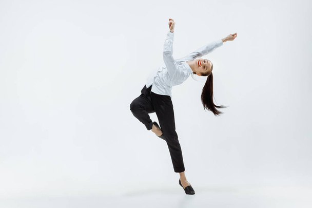 Happy business woman dancing and smiling isolated on white. - Valokuva, kuva