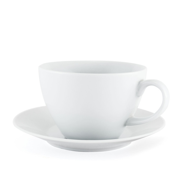 Empty ceramic tea cup over white plate - Fotó, kép