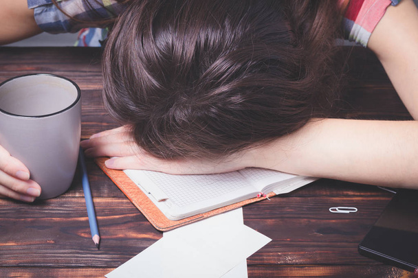 Girl tired student falls asleep. Study session. - Фото, изображение