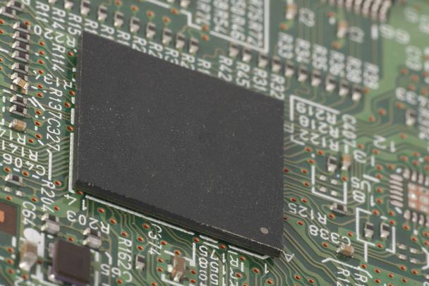Electronic circuit board close up. Microchips and other components Small depth of field - Photo, image
