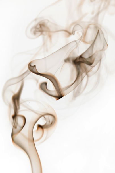 Swirling smoke from the incense on a homogeneous background - Foto, Imagem