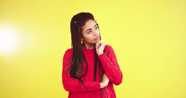 Beautiful mulled lady multi ethnic in a studio with a yellow wall background portrait looking straight to the camera and smiling with a beautiful white teeth , she have a dreadlocks and wearing a red - Footage, Video