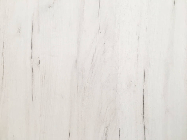 washed wooden texture background, light soft oak of weathered distressed wash wood with faded varnish paint showing woodgrain texture. white hardwood planks pattern table top view - Foto, Bild